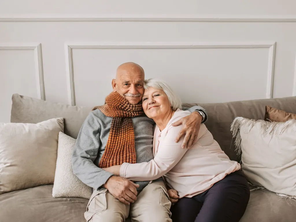 Senior couple relaxing at home after releasing equity with an enhanced lifetime mortgage